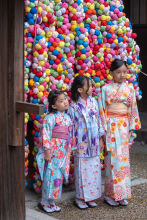 Three young girls pose for a photograph